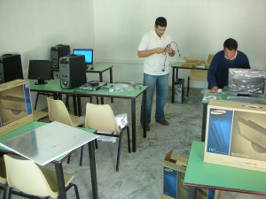 Ra'ouf and Uday help me unpack and set up the systems.