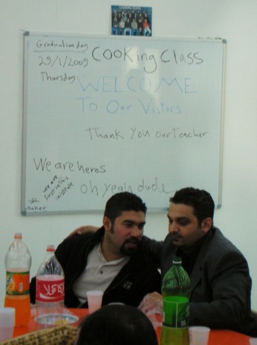 The cooking class thanks Abu Saif, their teacher