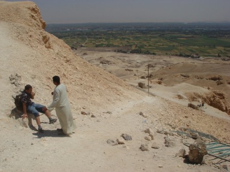 Ahmad consoles a nervous Haitham on the mountain overlooking the Nile Valley