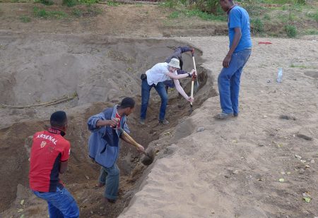 The dried-up riverbed still has water a few feet below it (for now) so I stopped to help some locals dig it out